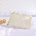 Bolsa Muñequera Croco Beige