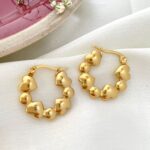 Arracadas "Eternal Love" – Aros de Corazones Entrelazados en Oro Acero Inoxidable